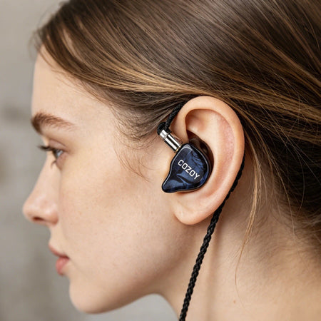 COZOY D2 in-ear monitor worn in the ear, showing its ergonomic fit