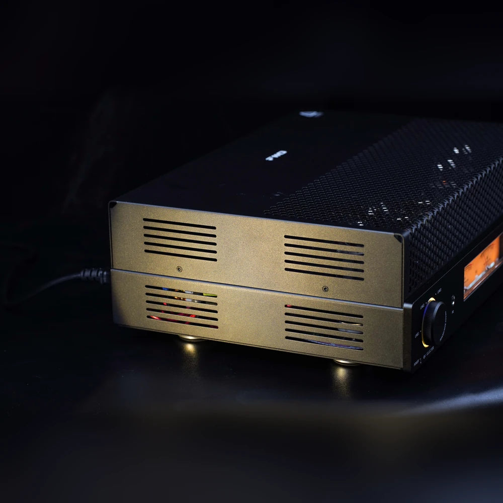 FiiO EA13 black tube amplifier side view showing grille ventilation and vibration-damping feet