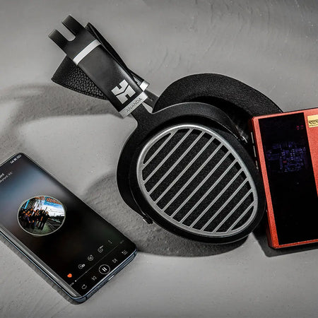 HIFIMAN Ananda Stealth planar headphone beside a smartphone and a portable music player