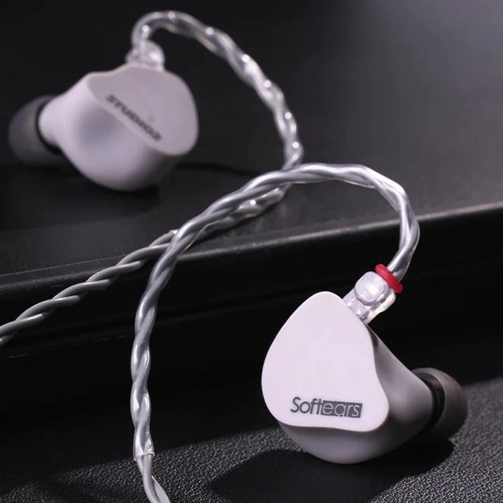 Softears Studio 2 earphones on dark reflective surface