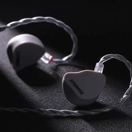 Softears Studio 2 earphone detail shot on dark surface