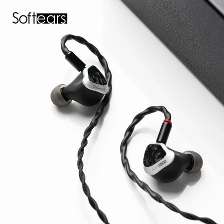 Softears Volume S earphones angled view beside their carrying case